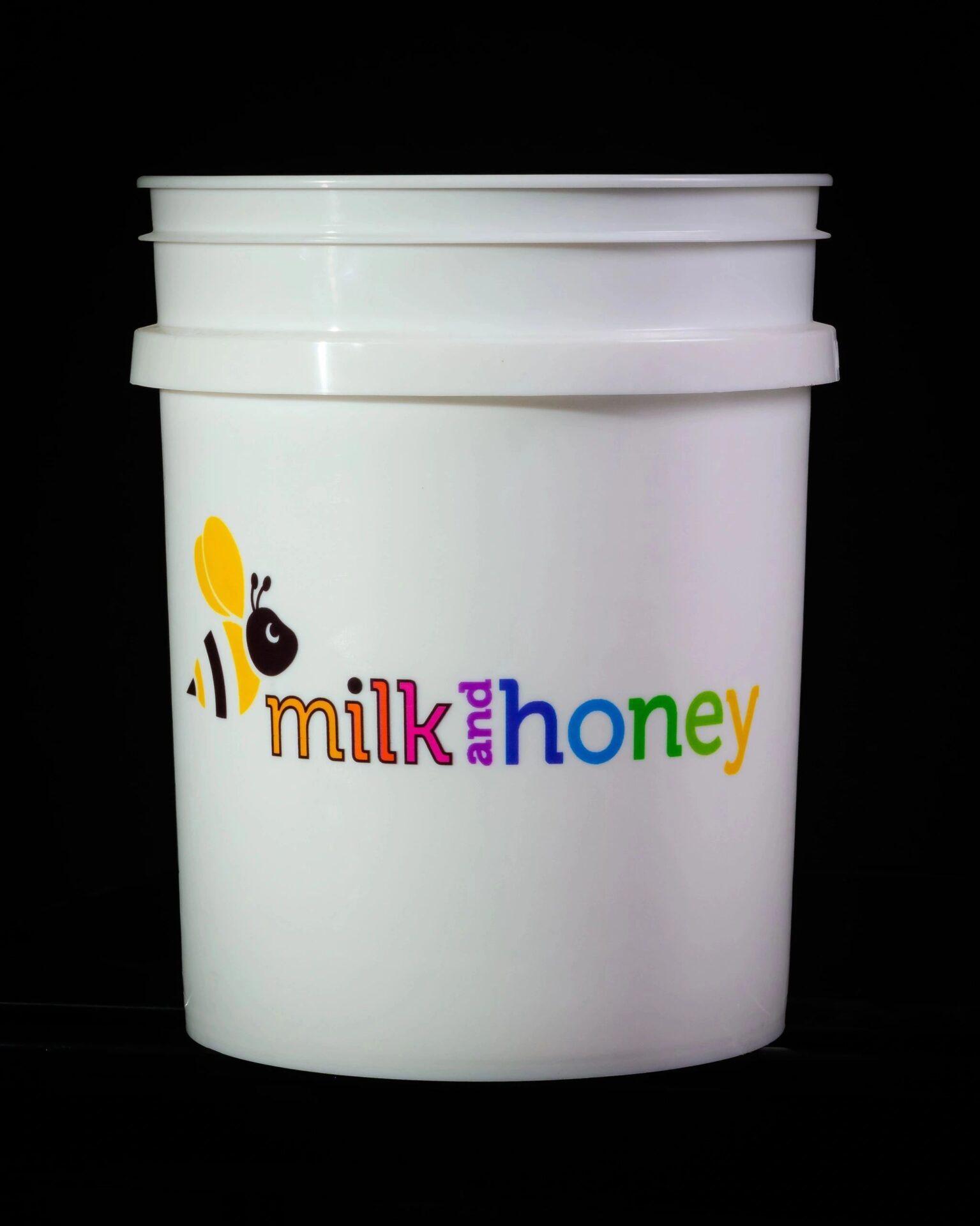 Milk and Honey logo on a bucket